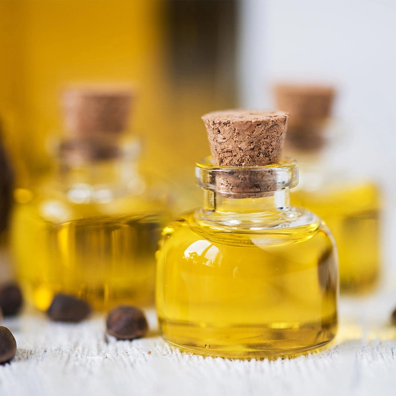 Glass bottles filled with essential oil on the table